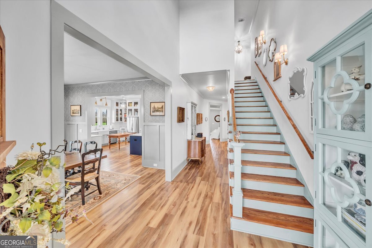 117 Pine Bough Trail Perry, GA 31069 - Photo 8 of 83 a view of a dining room with furniture and wooden floor