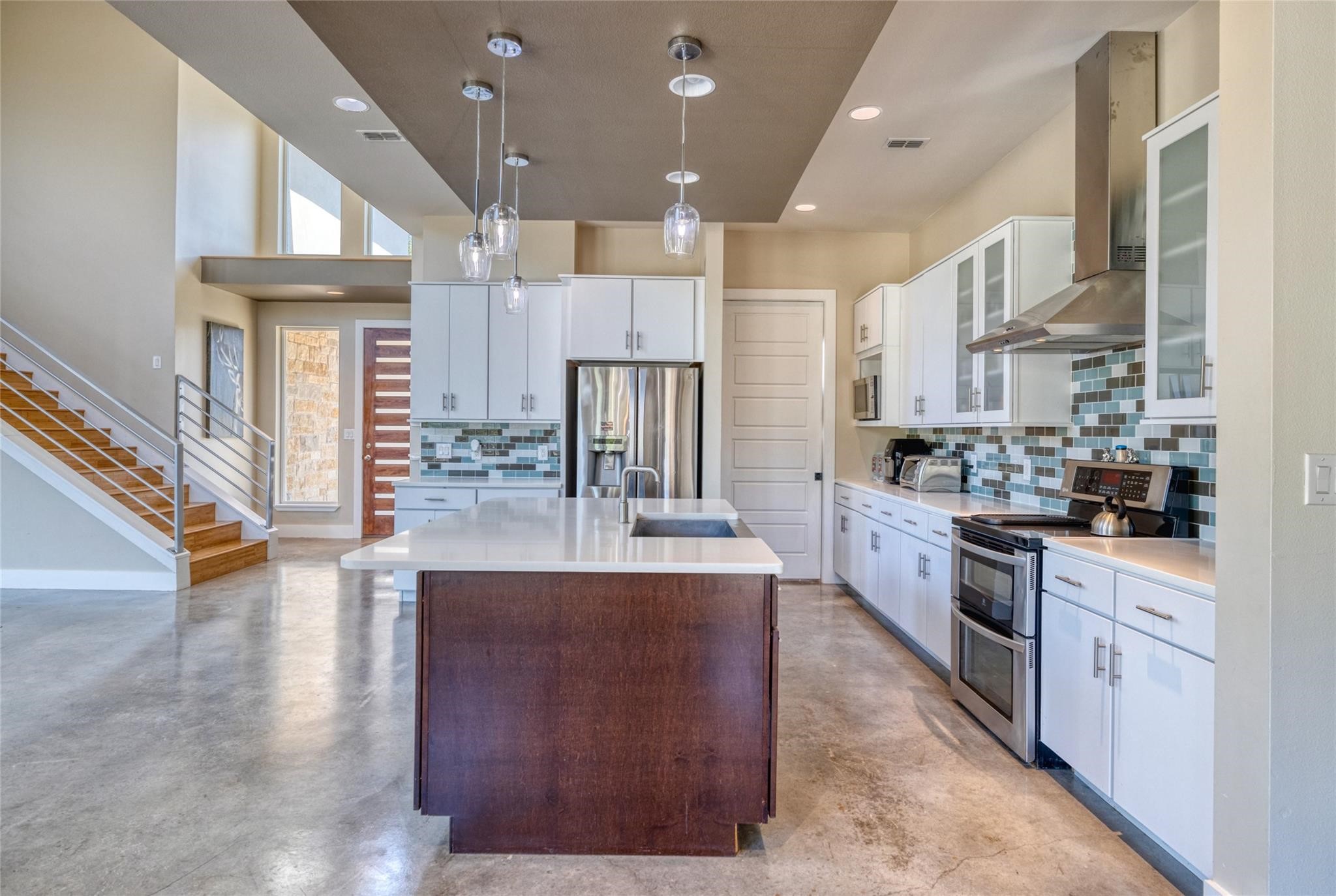 51 Starry Night Concan, TX 78838 - Photo 6 of 8 a large kitchen with stainless steel appliances lots of counter space and a refrigerator