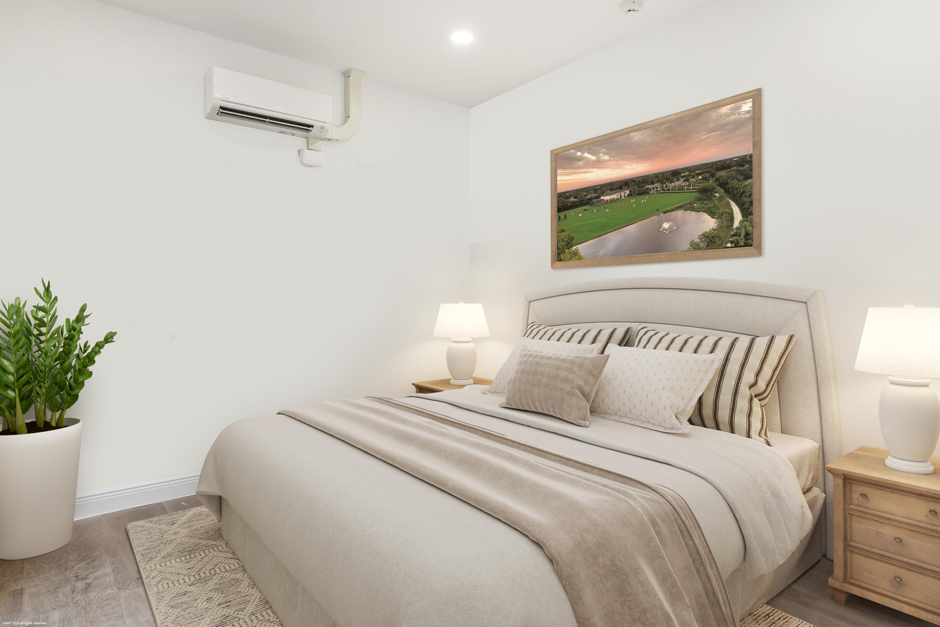 15527 Imperial Point Lane Wellington, FL 33414 - Photo 147 of 184 a bedroom with a bed and a painting on the wall