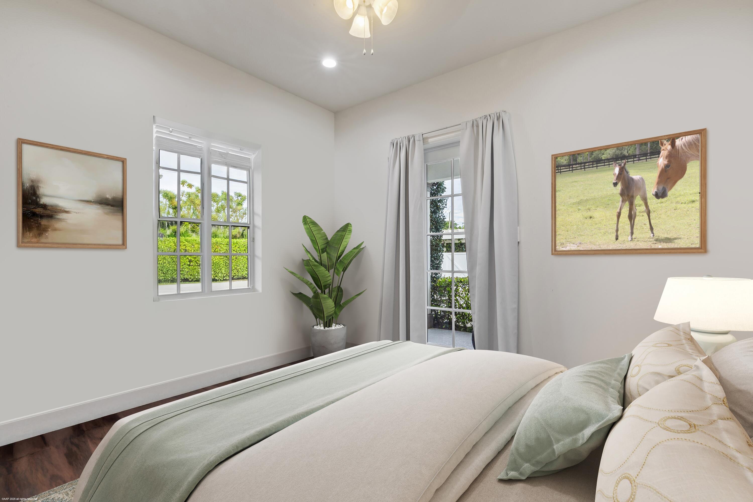 15527 Imperial Point Lane Wellington, FL 33414 - Photo 151 of 184 a bedroom with a bed and a window