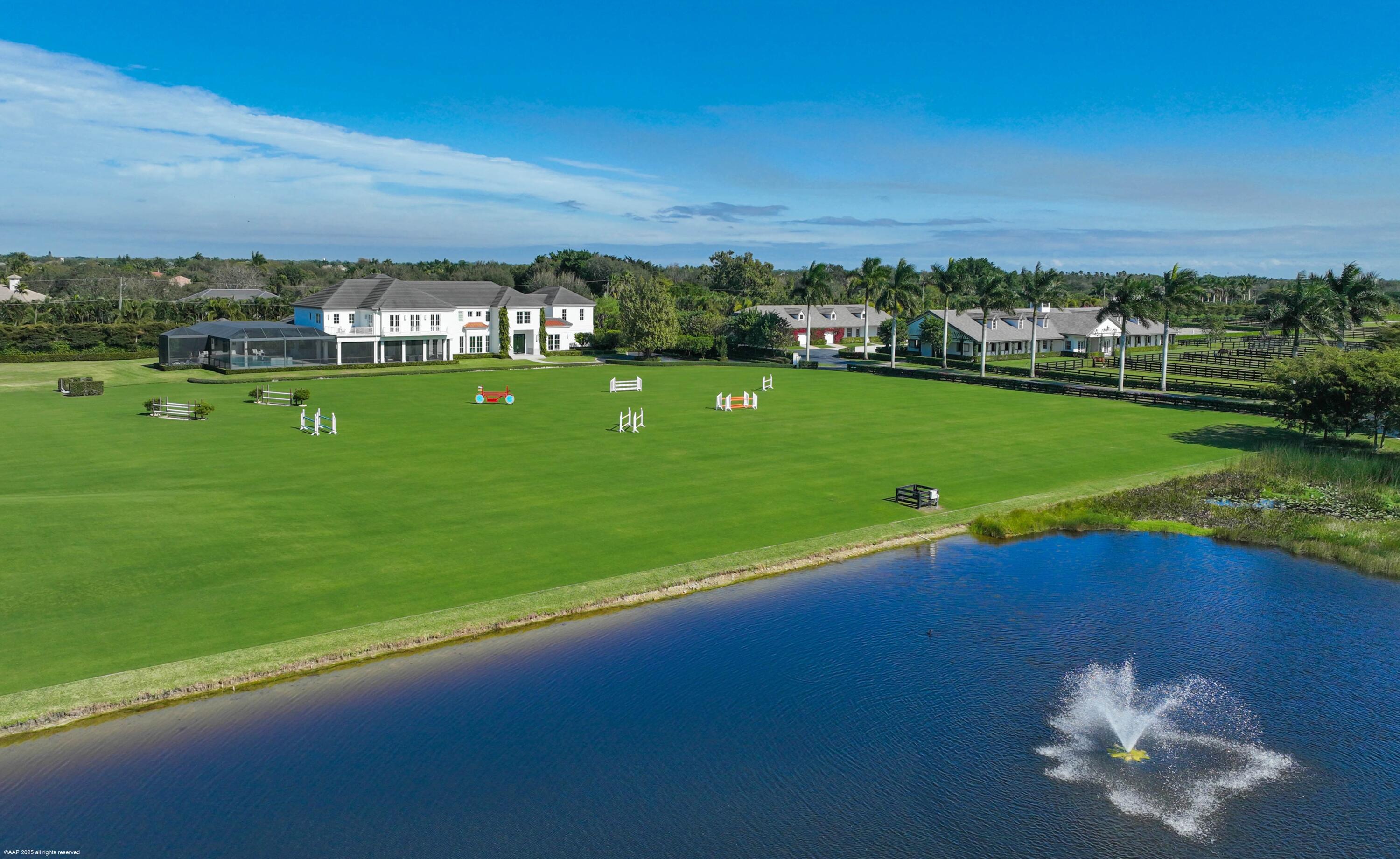 15527 Imperial Point Lane Wellington, FL 33414 - Photo 16 of 184 a view of a golf course with a lake