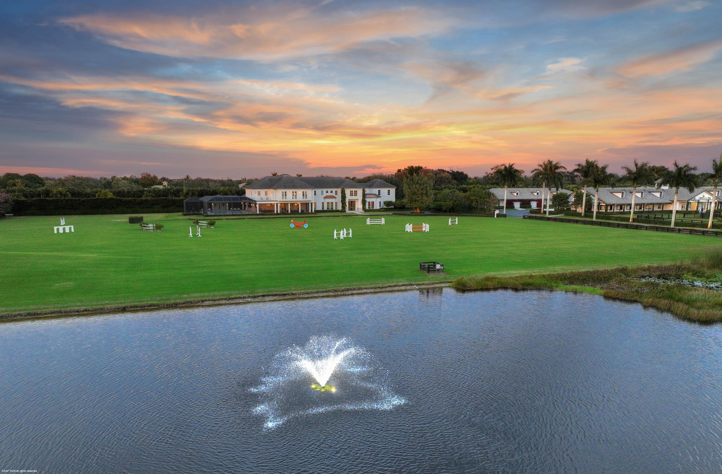 15527 Imperial Point Lane Wellington, FL 33414 - Photo 177 of 184 a view of a golf course with a lake