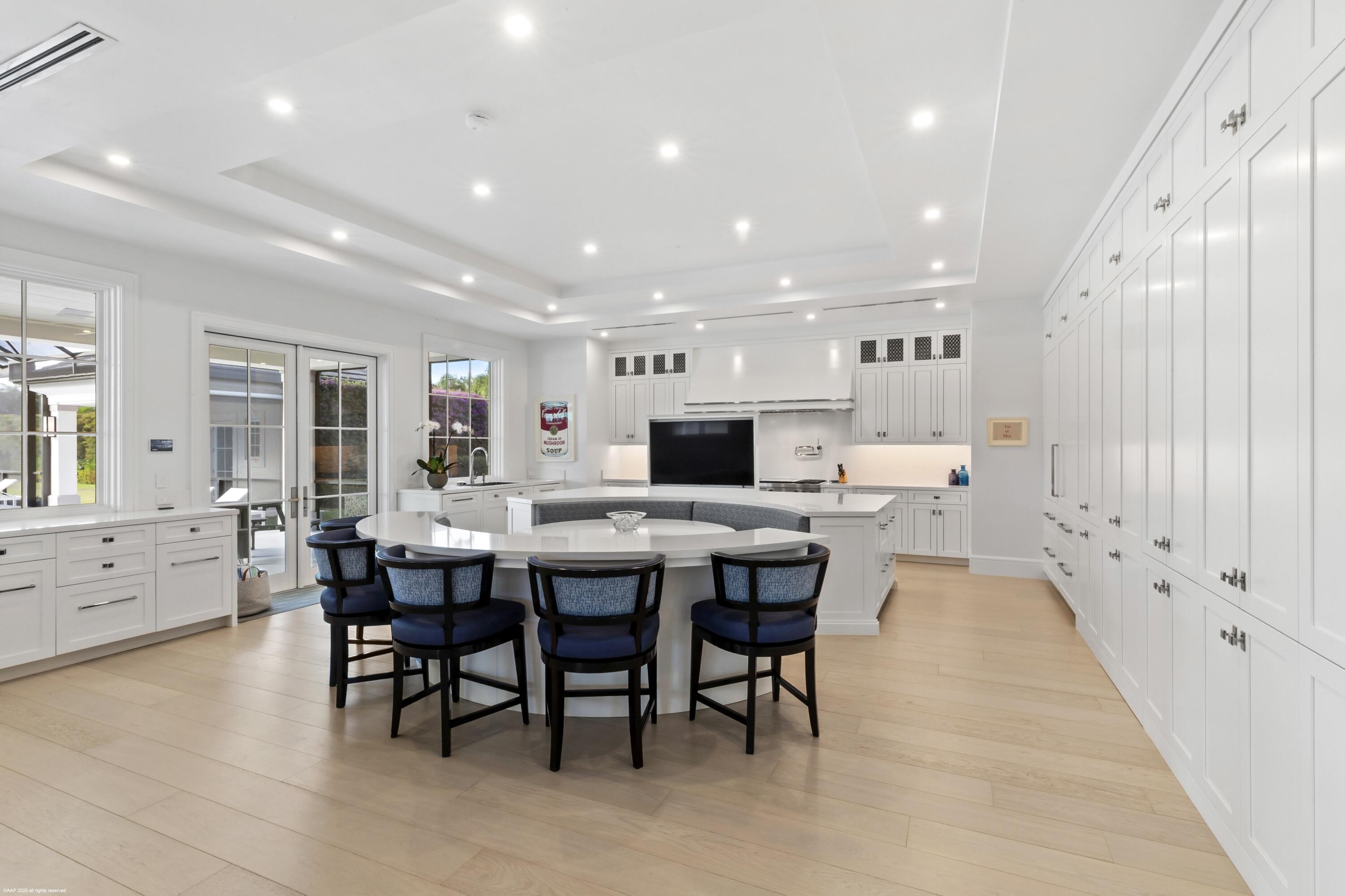 15527 Imperial Point Lane Wellington, FL 33414 - Photo 39 of 184 a large kitchen with a table and chairs in it