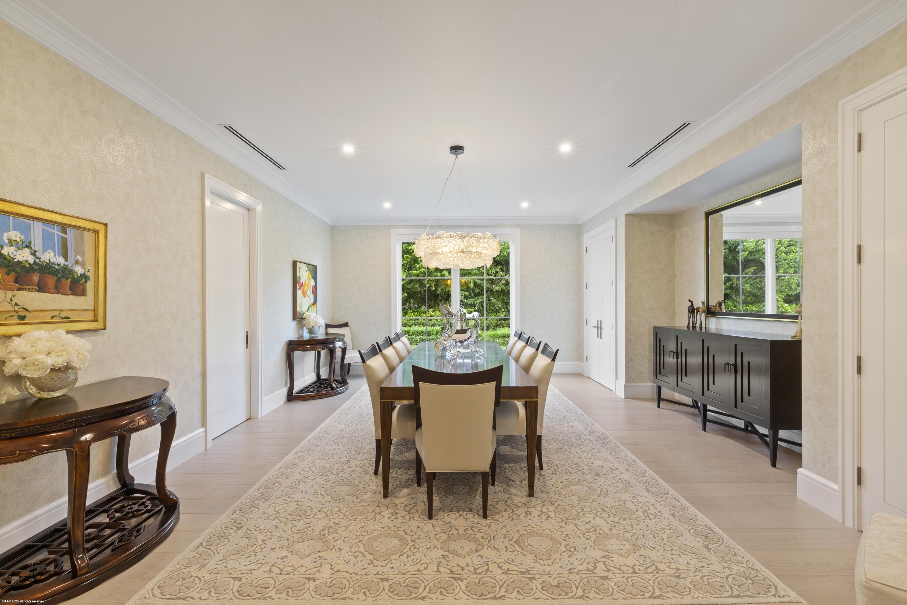 15527 Imperial Point Lane Wellington, FL 33414 - Photo 45 of 184 a dining room with furniture a rug and a floor to ceiling window
