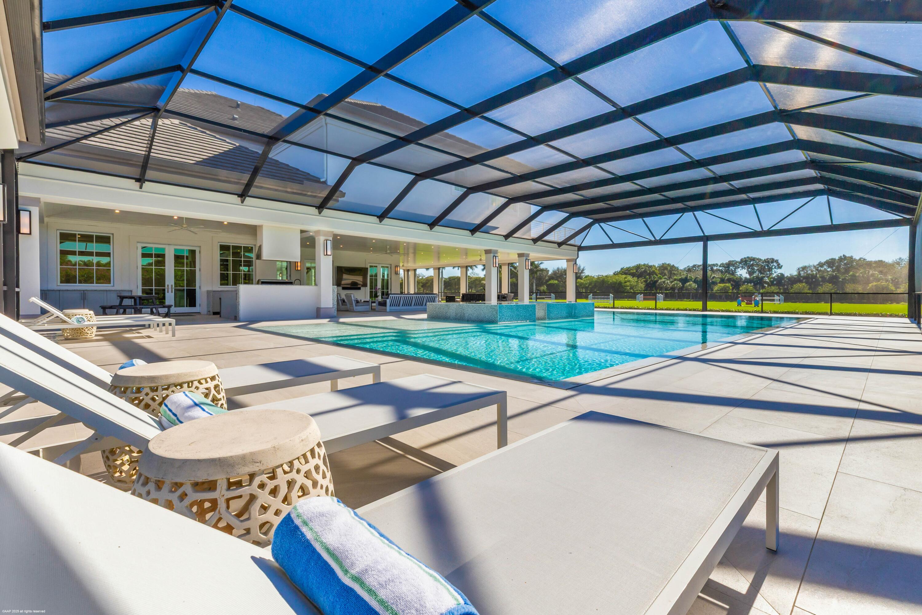 15527 Imperial Point Lane Wellington, FL 33414 - Photo 90 of 184 a view of a backyard with sitting area