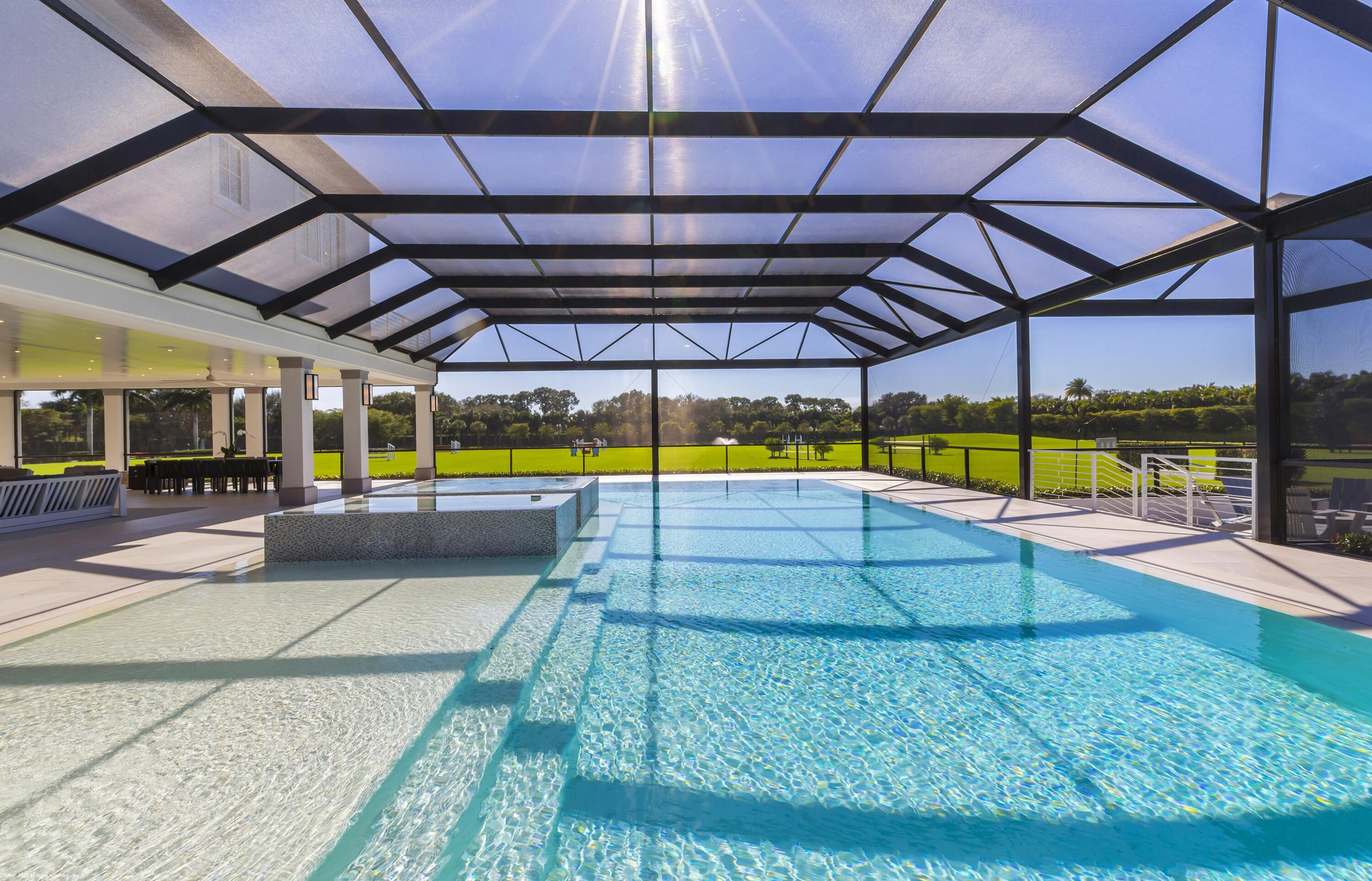 15527 Imperial Point Lane Wellington, FL 33414 - Photo 93 of 184 a view of a swimming pool with a porch