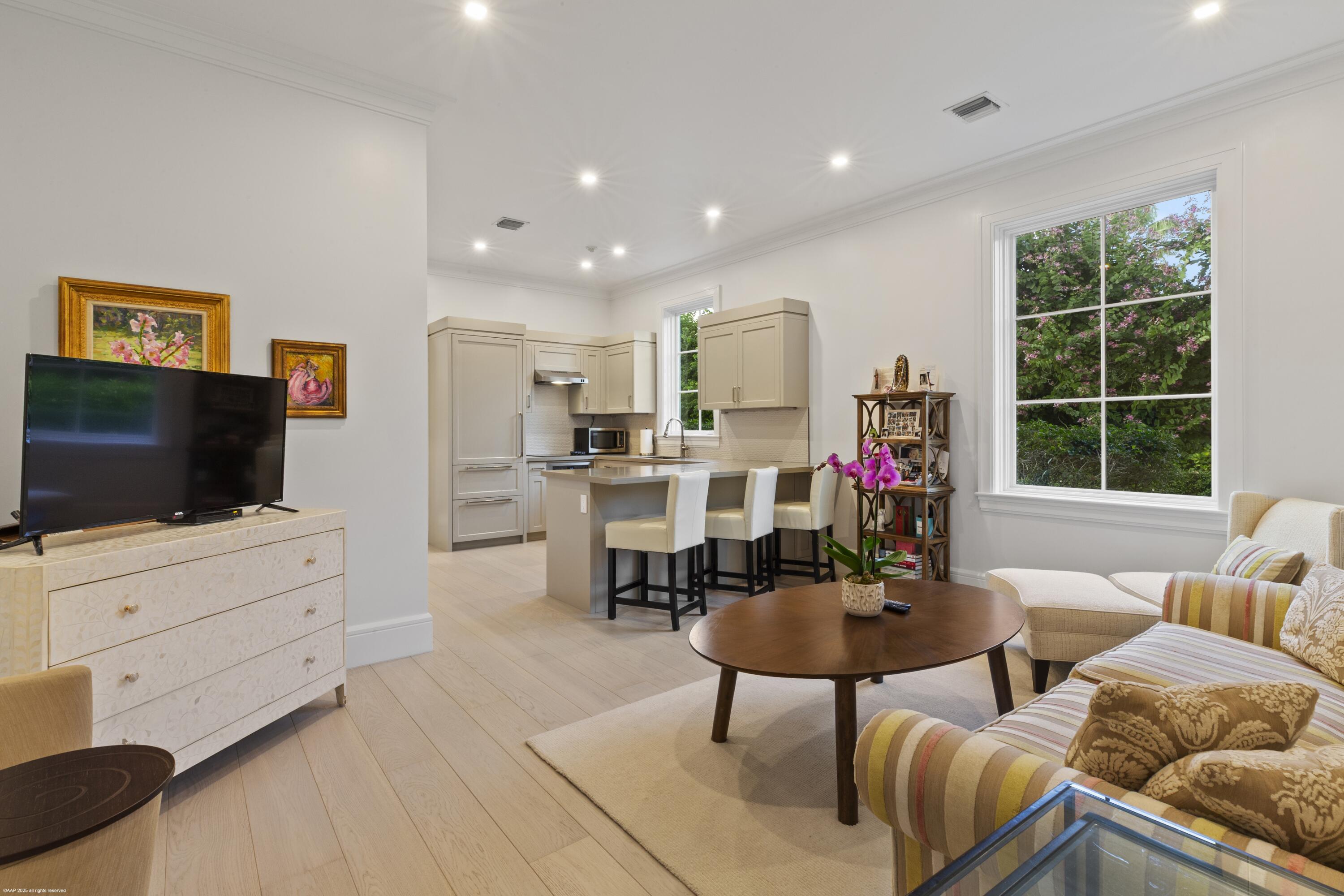 15527 Imperial Point Lane Wellington, FL 33414 - Photo 100 of 184 a living room with furniture and a flat screen tv