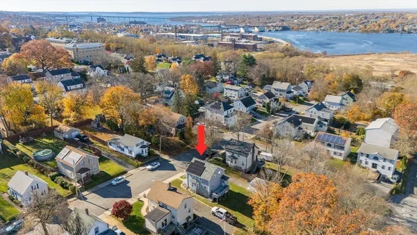 an aerial view of residential houses with outdoor space
