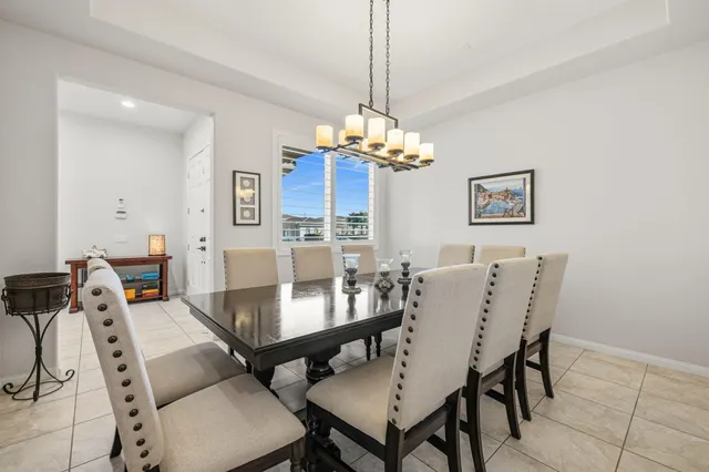 a bedroom with a bed and a flat tv screen on dresser