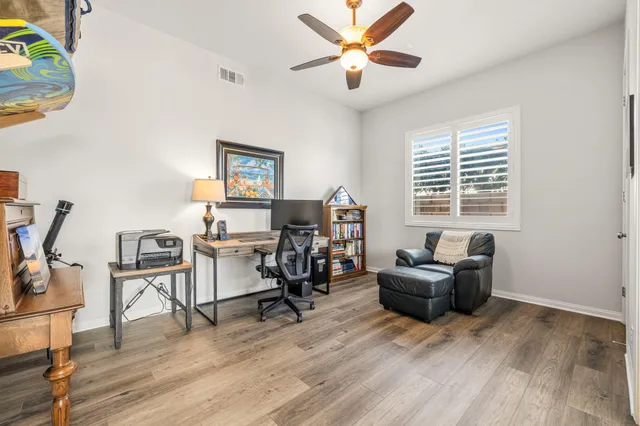 a kitchen with granite countertop a sink and cabinets