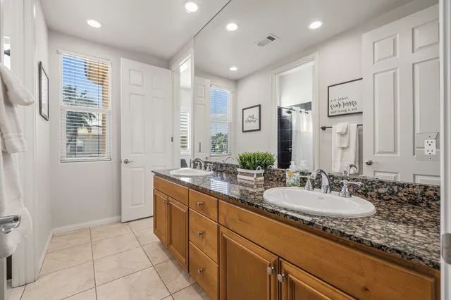 a view of a street with a house in the background