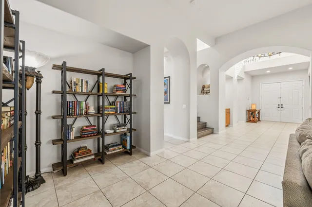 a large kitchen with granite countertop a stove and a sink