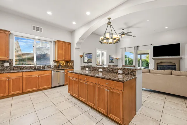 a view of a dining room with furniture and window