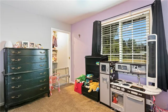 a room that has a bed and a chair in it