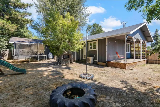 a dining room with furniture and a window