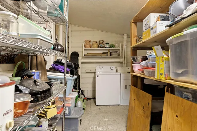 a bathroom with a sink and a refrigerator
