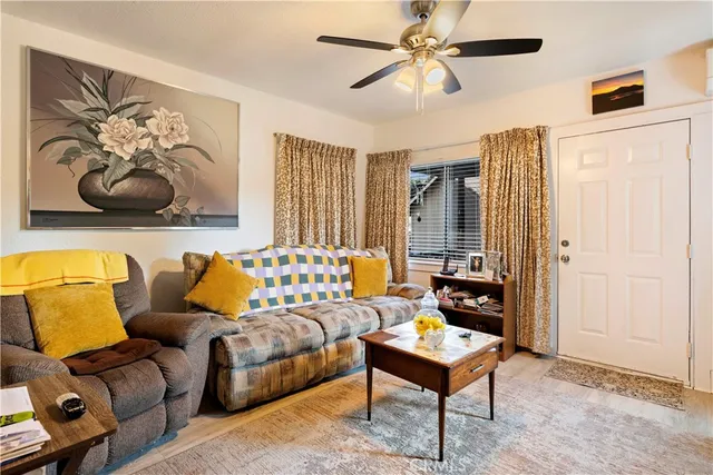 a backyard of a house with barbeque oven and outdoor seating