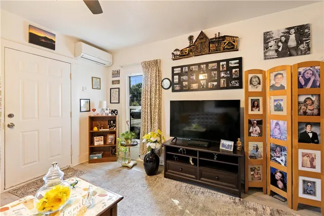 a backyard of a house with large trees and wooden fence