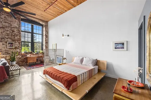 a bedroom with furniture and a bed