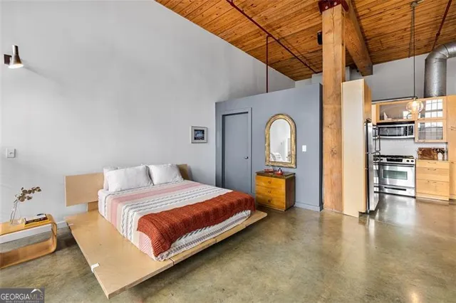 a bedroom with a bed and a table