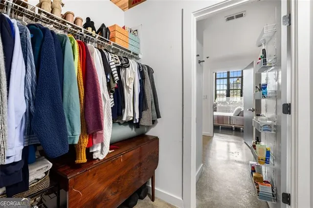 a view of storage and utility room with washer and dryer