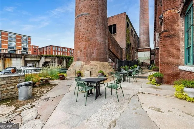 a view of a building with sitting area