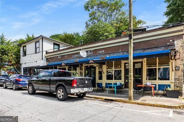 a front view of a house with a large window