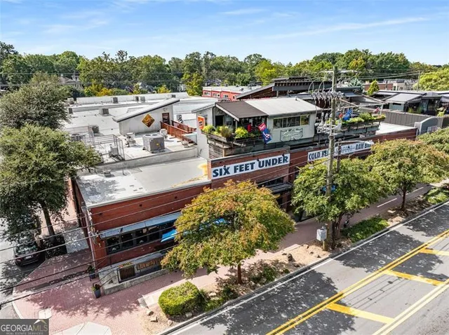 a view of building with glass windows and door