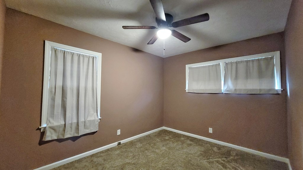 5552 Perry Avenue Columbus, GA 31909 - Photo 9 of 14 an empty room with windows