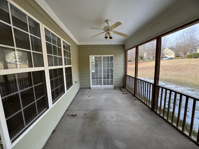 a view of empty room with windows