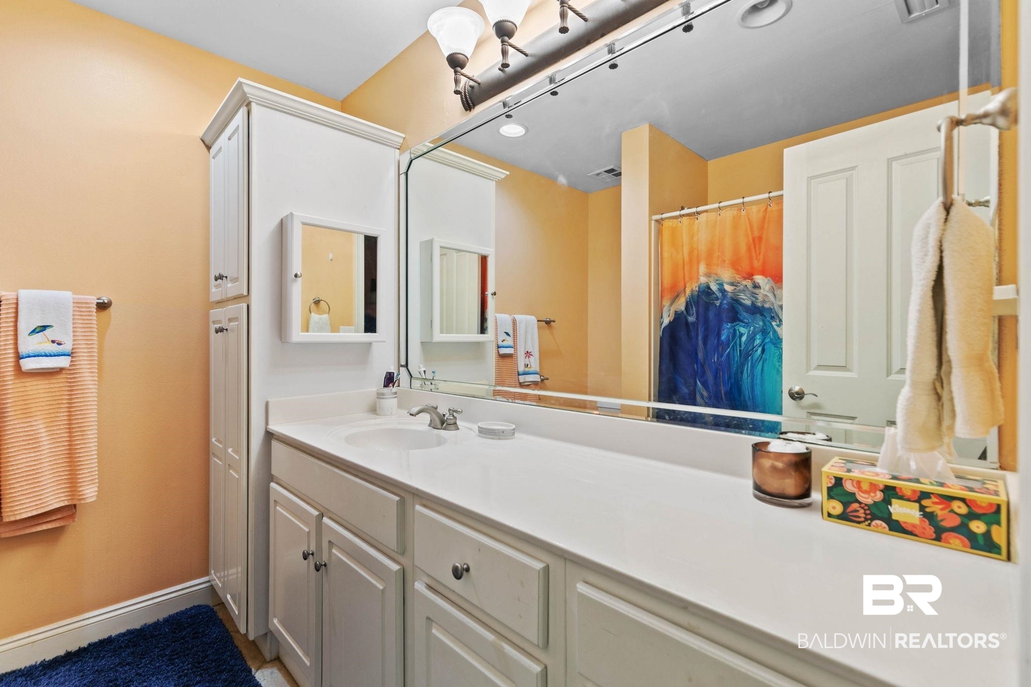 28250 Canal Road, Unit 208 Orange Beach, AL 36561 - Photo 42 of 53 Bathroom with vanity and a shower with curtain