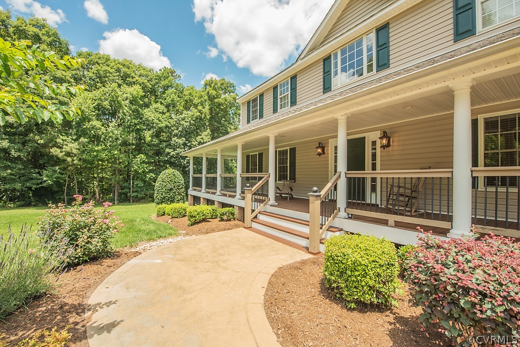 11710 Taplow Road Midlothian, VA 23112 - Photo 14 of 48 front view of a house with a yard and potted plants