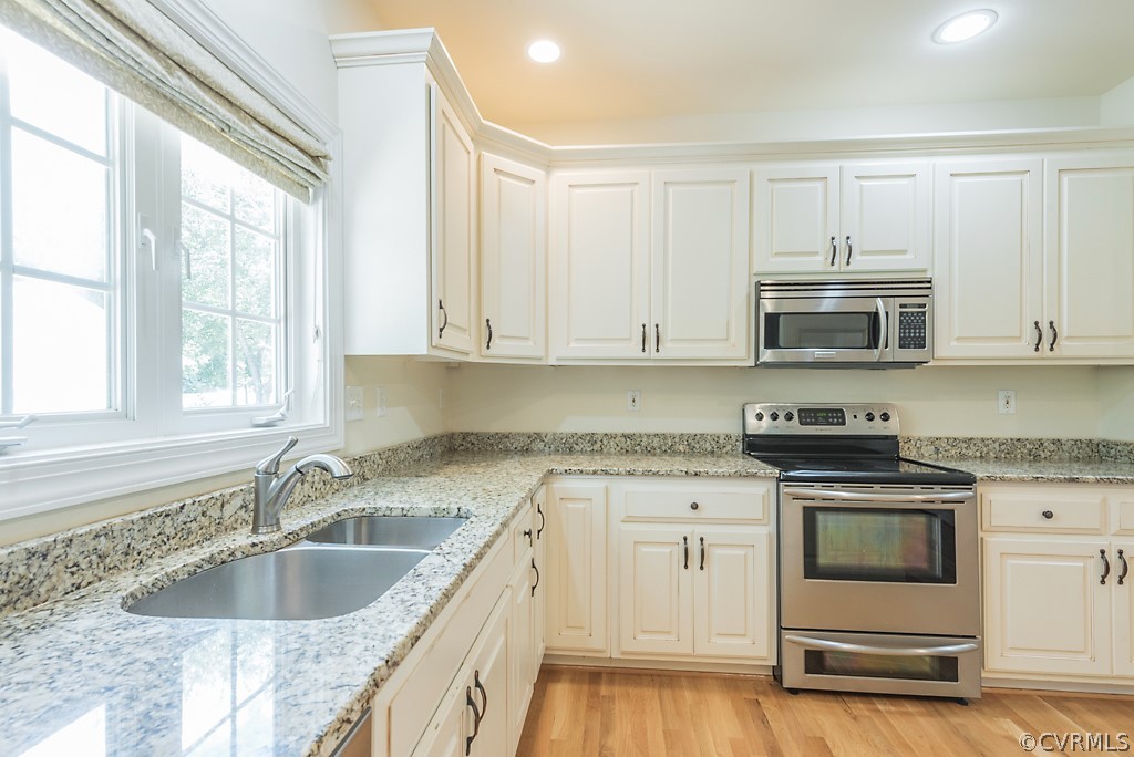 11710 Taplow Road Midlothian, VA 23112 - Photo 25 of 48 a kitchen with granite countertop a sink and a stove top oven
