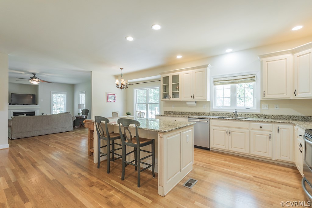 11710 Taplow Road Midlothian, VA 23112 - Photo 29 of 48 a large kitchen with granite countertop lots of white cabinets appliances and furniture