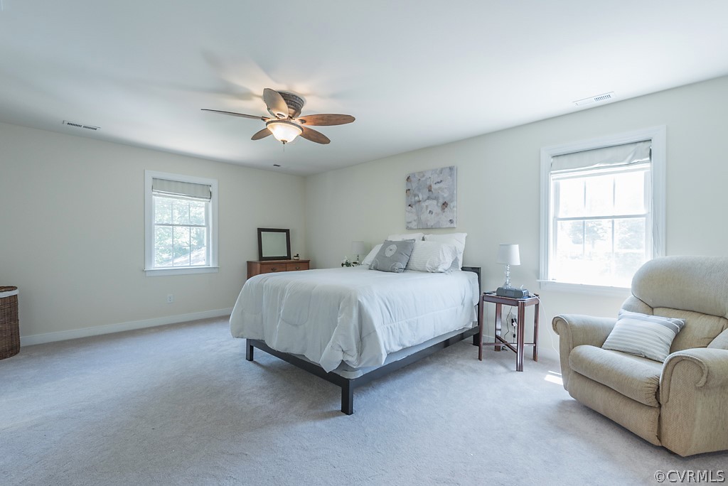 11710 Taplow Road Midlothian, VA 23112 - Photo 32 of 48 a bedroom with a bed couch and window