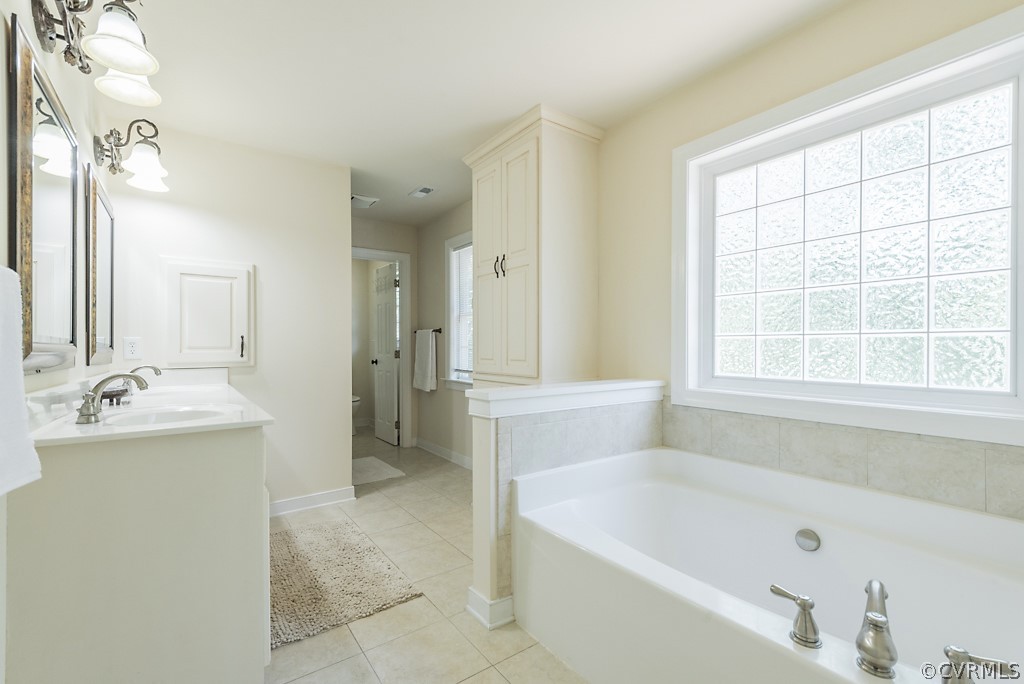 11710 Taplow Road Midlothian, VA 23112 - Photo 34 of 48 a bathroom with a bathtub and a sink