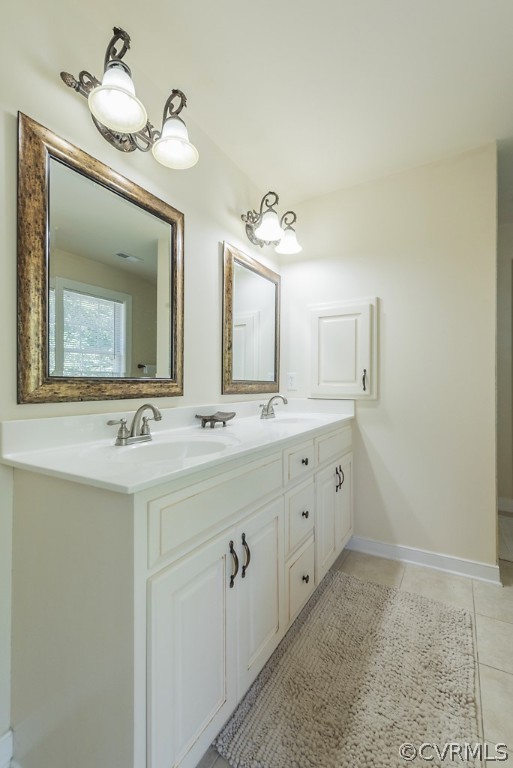 11710 Taplow Road Midlothian, VA 23112 - Photo 35 of 48 a spacious bathroom with a double vanity sink and a mirror