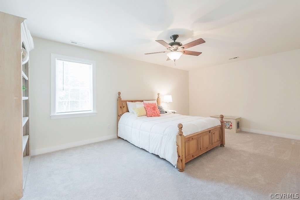 11710 Taplow Road Midlothian, VA 23112 - Photo 37 of 48 a bedroom with a bed and a ceiling fan