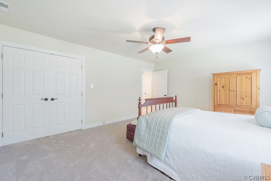 11710 Taplow Road Midlothian, VA 23112 - Photo 40 of 48 a bedroom with a bed and a chandelier
