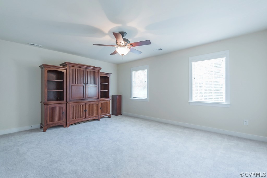 11710 Taplow Road Midlothian, VA 23112 - Photo 42 of 48 a living room with furniture and a ceiling fan
