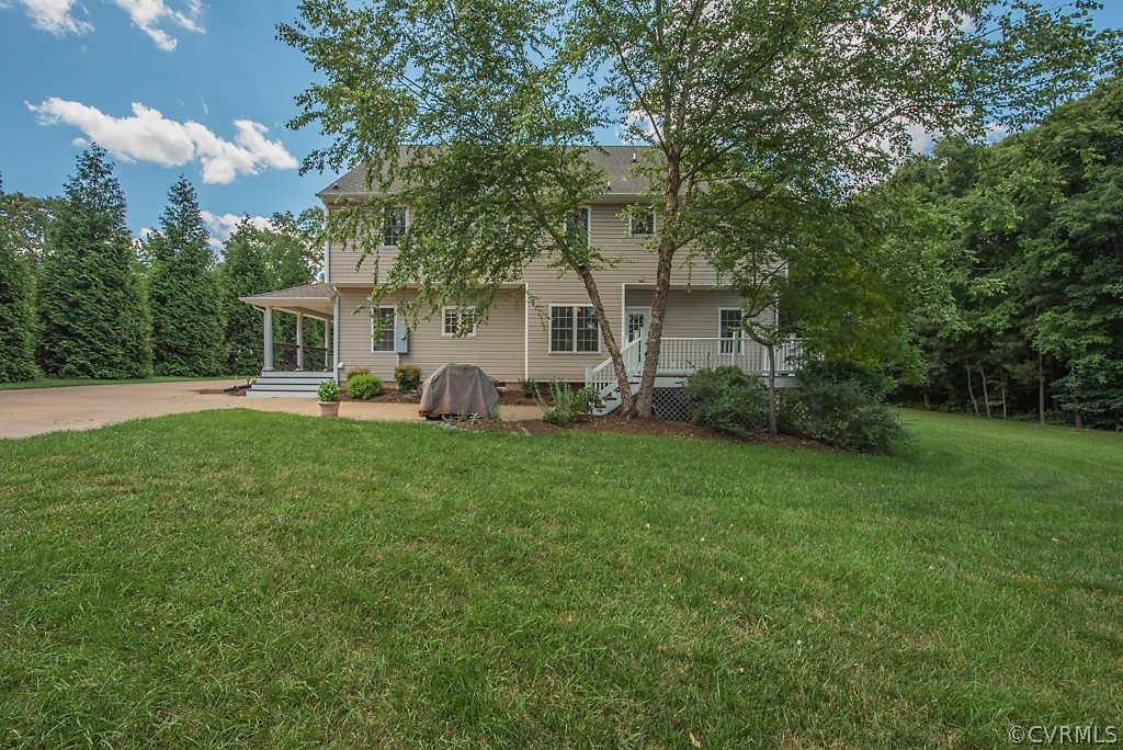 11710 Taplow Road Midlothian, VA 23112 - Photo 8 of 48 a front view of house with yard and green space