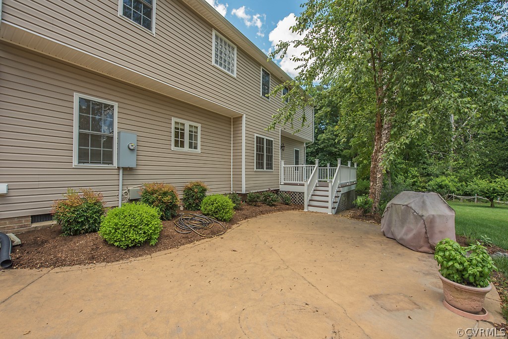 11710 Taplow Road Midlothian, VA 23112 - Photo 9 of 48 a backyard of a house with outdoor seating and plants
