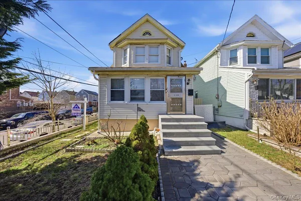 front view of a house with a yard