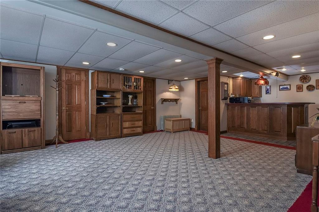 50 Bellview Circle McKees Rocks, PA 15136 - Photo 13 of 24 Huge game room with built in cabinetry and wet bar. Perfect area for STEELER parties.