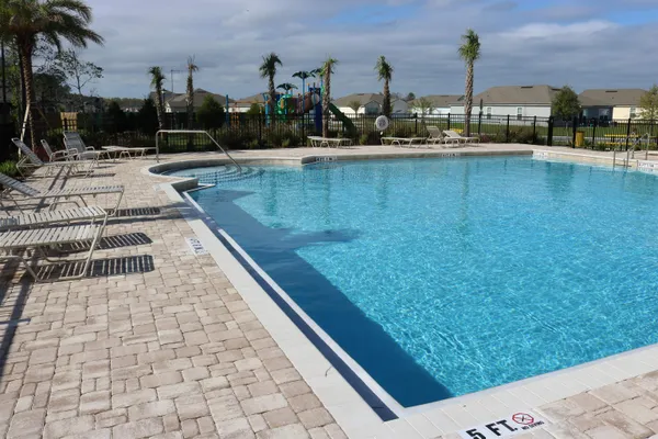a view of swimming pool from a balcony
