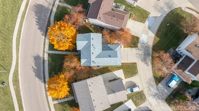 an aerial view of a house with a swimming pool