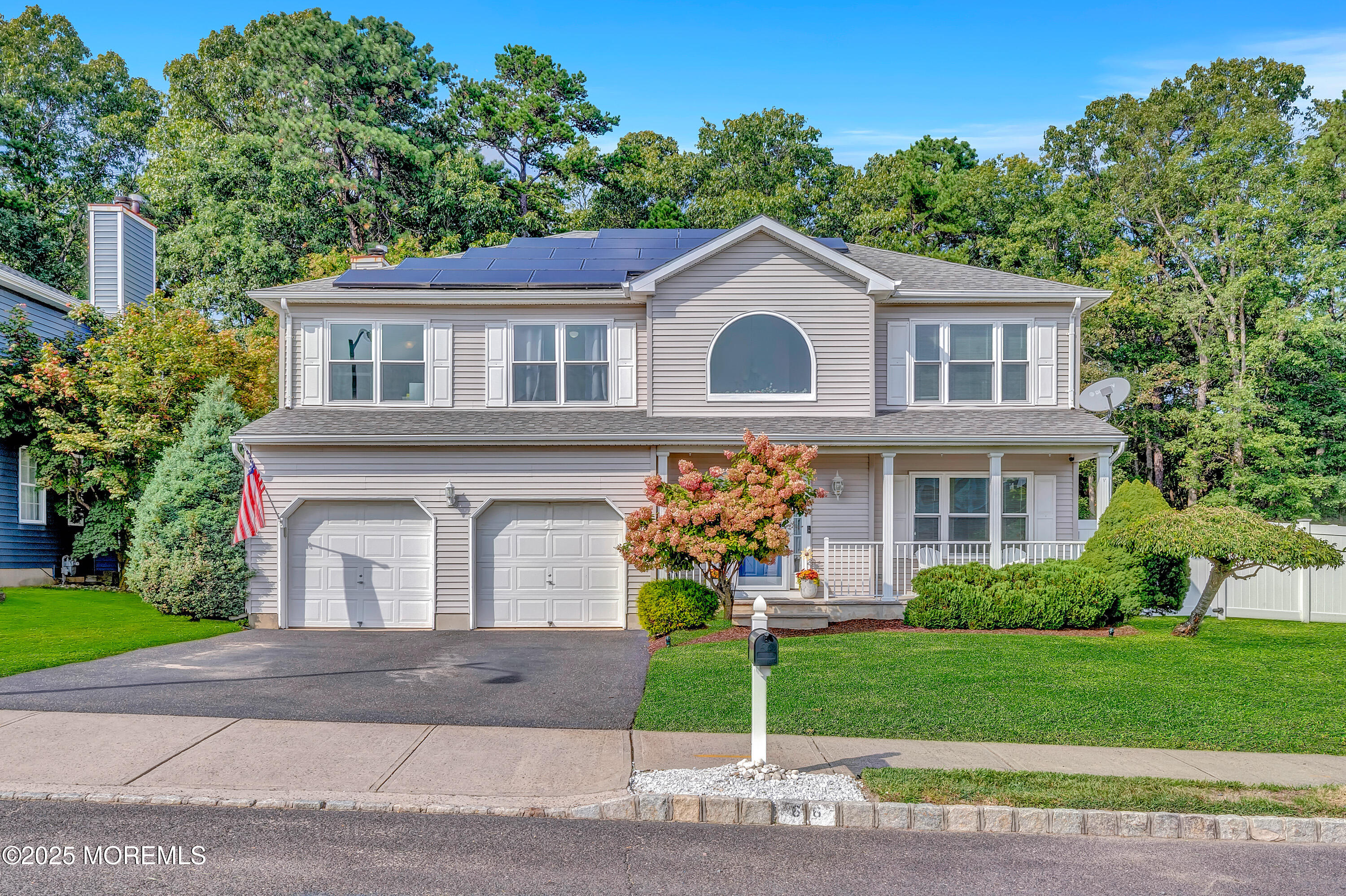 66 Diamond Lane Howell, NJ 07731 - Photo 2 of 47 a front view of a house with a garden and plants