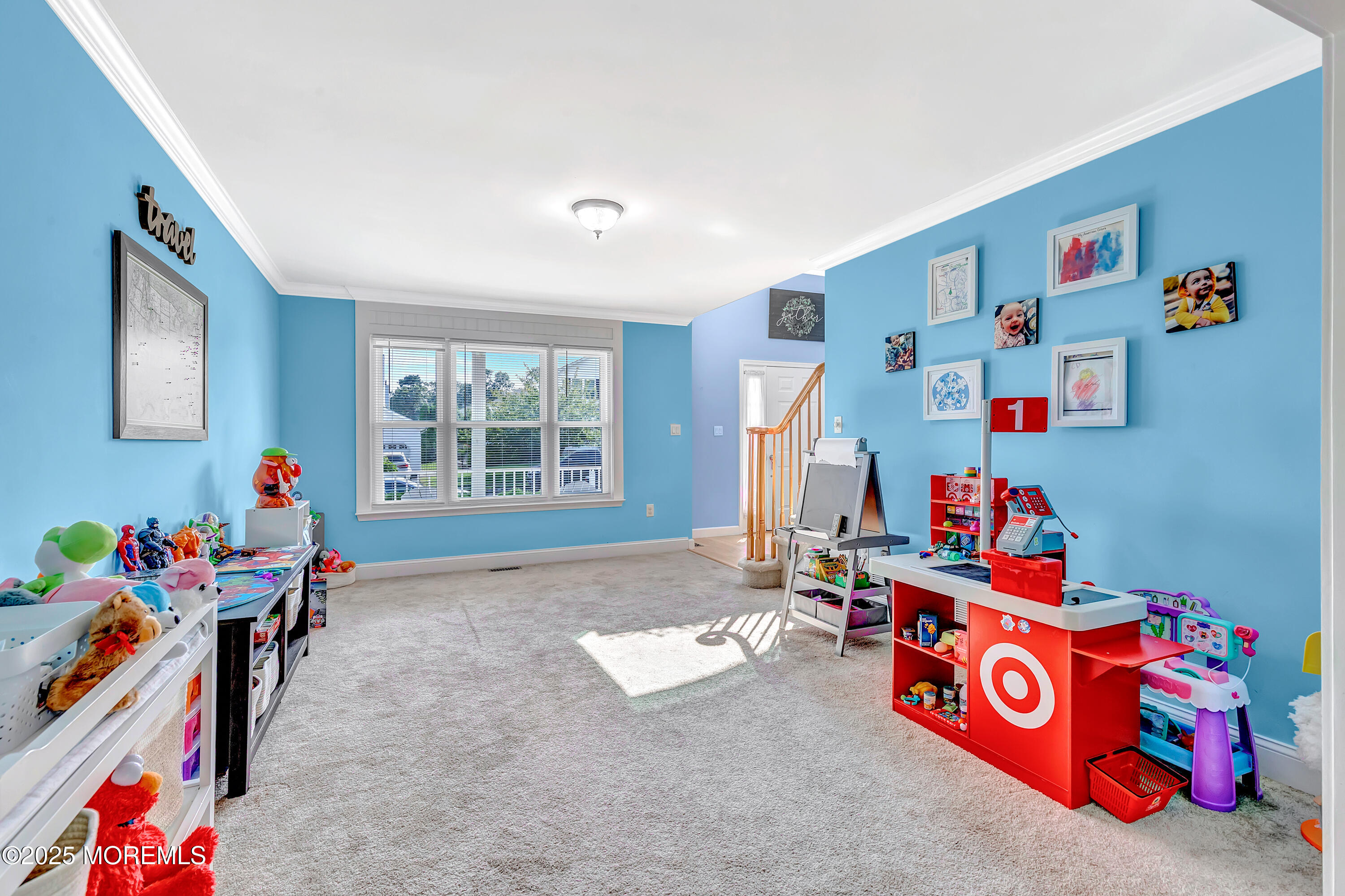 66 Diamond Lane Howell, NJ 07731 - Photo 21 of 47 a living room with lots of baby toys and furniture