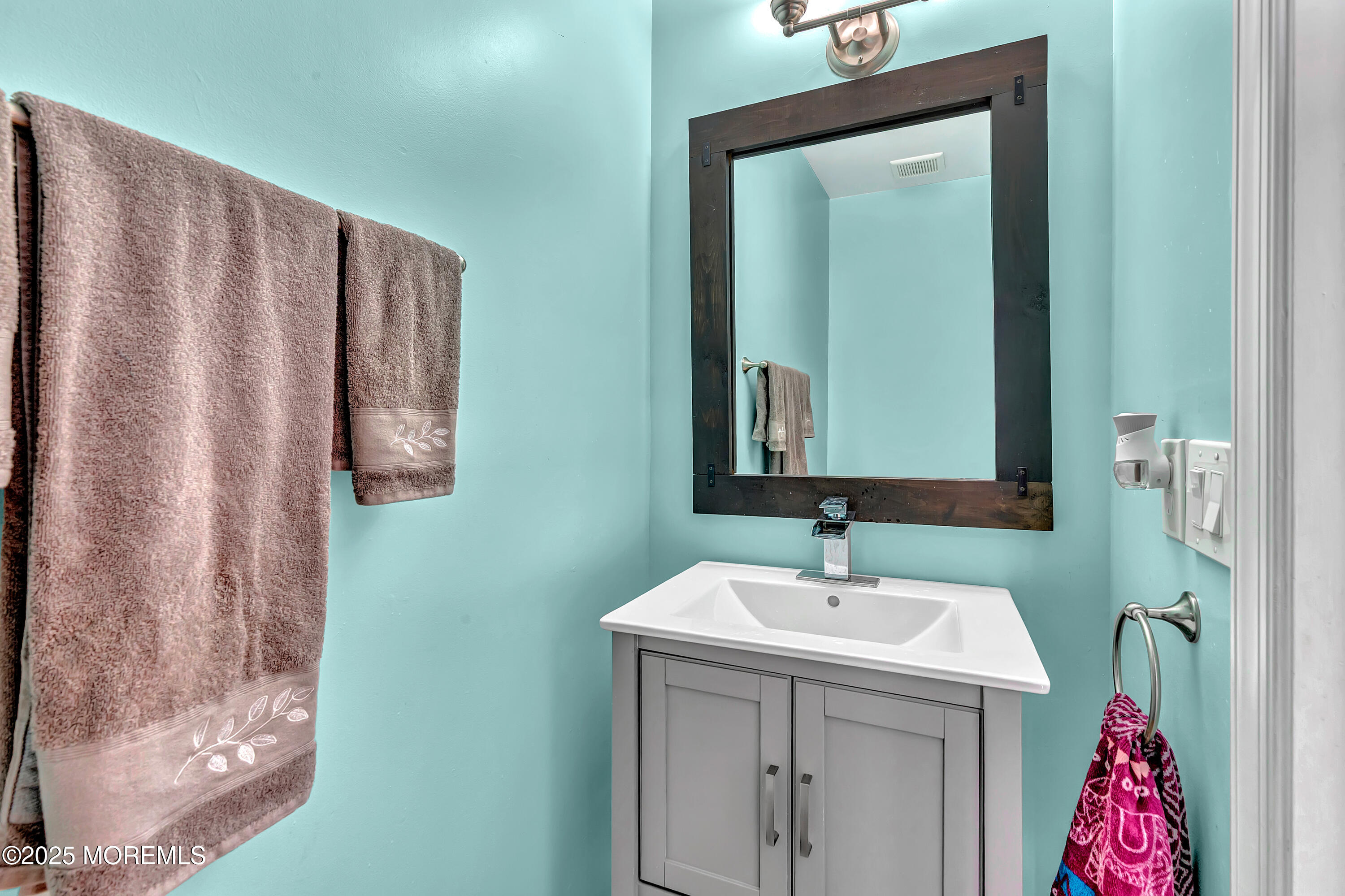 66 Diamond Lane Howell, NJ 07731 - Photo 23 of 47 a bathroom with a sink and a mirror