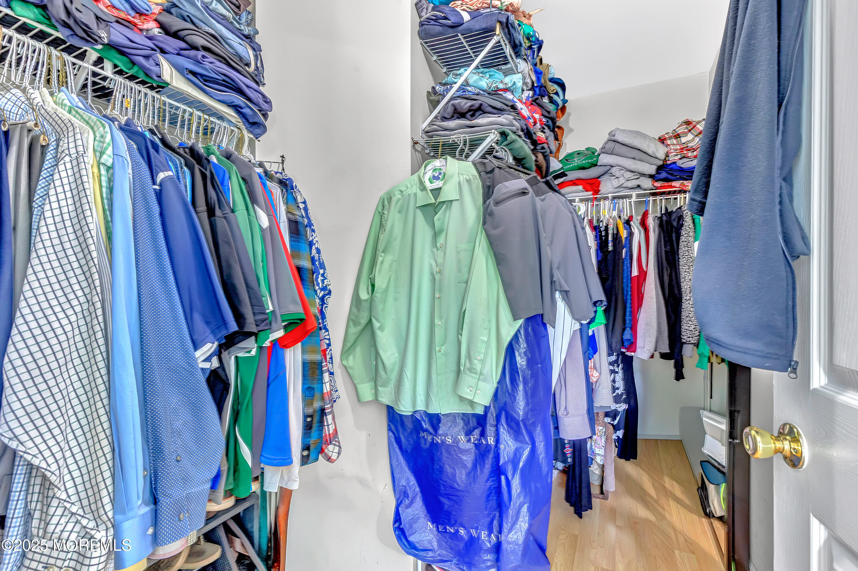 66 Diamond Lane Howell, NJ 07731 - Photo 28 of 47 a view of walk in closet with clothes